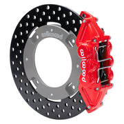 Wilwood red rear caliper beside the assembled 11.25-inch drilled rotor for the Can-Am Maverick X3 UTV4 brake conversion