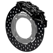Wilwood black front caliper beside the assembled 11.25-inch drilled rotor for the Polaris RZR Turbo and Pro XP UTV6 brake conversion