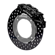 Wilwood black front caliper beside the assembled 11.25-inch drilled rotor for the Polaris RZR 1000 and RS1 UTV6 brake conversion