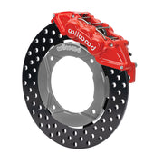 Wilwood red front caliper beside the assembled 11.25-inch drilled rotor for the Polaris RZR 1000 and RS1 UTV6 brake conversion
