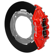Wilwood red rear caliper beside the assembled 11.25-inch undrilled rotor for the Polaris RZR 1000 and RS1 UTV6 brake conversion