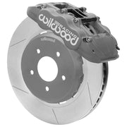 Wilwood gray anodized front caliper beside the assembled 13.00-inch slotted rotor for the Ford Mustang GN4R-ST race brake conversion