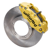 Wilwood front FNSL4R brake kit for Porsche 911 early 20 mm configuration: Yellow FNSL4R caliper positioned over a plain-faced rotor, with the central opening and five rotor-mount holes visible.
