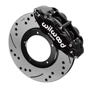Wilwood front FNSL4R brake kit for Porsche 911 Carrera 24 mm configuration: Black FNSL4R caliper positioned over a drilled and slotted rotor, with the central opening and five rotor-mount holes visible.