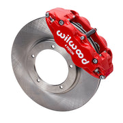 Wilwood front FNSL4R brake kit for Porsche 911 Carrera 24 mm configuration: Red-finish FNSL4R caliper positioned over a plain-faced rotor, with the central opening and five rotor-mount holes visible.