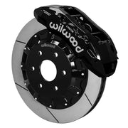 Wilwood front TX6R brake kit for Ram 1500 six-lug: Black TX6R caliper over a slotted rotor and black center hat in an assembled brake view.