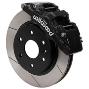 Wilwood front AERODM brake kit for early GM 1500 trucks: Assembled black AERODM caliper over a slotted rotor with a black center and large hub opening.