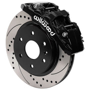 Wilwood front AERODM brake kit for later GM 1500 trucks/SUVs: Assembled black AERODM caliper over a drilled and slotted rotor with a black center and large hub opening.