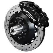 Wilwood front FNSL6R brake kit for Tri-Five ProSpindle 12.88-inch configuration: Assembled drilled and slotted rotor and black hat with a black FNSL6R caliper, projecting hub, five studs and a silver dust cap.