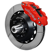 Wilwood front FNSL6R brake kit for Tri-Five ProSpindle 14-inch Superlite configuration: Assembled slotted rotor and black hat with a red-finish FNSL6R caliper, projecting hub, five studs and a silver dust cap.
