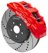 Wilwood front SX6R brake kit for Corvette C8: Red-finish SX6R caliper over a drilled and slotted rotor and silver center hat in an assembled brake view.
