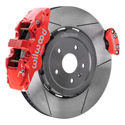 Wilwood rear AERO4 brake kit for Corvette C8 service and parking brakes: Assembled slotted rotor with a red-finish AERO4 caliper and a separate matching parking caliper on the opposite edge.