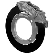 Wilwood front UTV6 brake kit for Honda Talon front race package: Assembled gray anodized UTV6 caliper over a black solid rotor ring and silver dynamic-mount adapter; the center opening is visible.