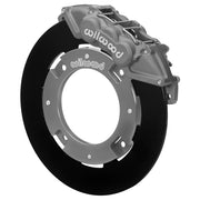 Wilwood front UTV6 brake kit for Can-Am Maverick X3 front race kit: Assembled gray anodized UTV6 caliper over a black solid rotor ring and silver dynamic-mount adapter; the center opening is visible.