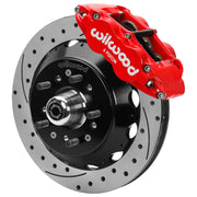 Wilwood front FNSL6R brake kit for No Limit ZG 14-inch conversion: Assembled drilled and slotted rotor and black hat with a red-finish FNSL6R caliper, projecting hub, five studs and a silver dust cap.