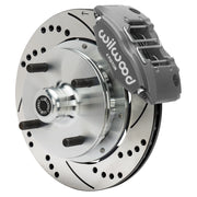 Wilwood front brake assembly with black four-piston caliper, drilled and slotted rotor and wheel hub