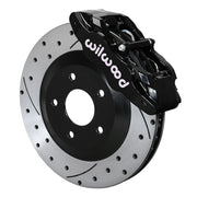 Wilwood black SLC56 front caliper beside the assembled 12.80-inch drilled and slotted rotor and hat for Corvette C5