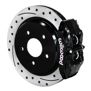 Wilwood black DPC56 rear caliper beside the assembled 12.01-inch drilled and slotted rotor and hat for Corvette C6 Base