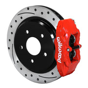Wilwood red DPC56 rear caliper beside the assembled 12.01-inch drilled and slotted rotor and hat for Corvette C6 Base