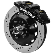 Wilwood black AERO6 front caliper beside the assembled 14.00-inch drilled and slotted rotor and hub for Chevrolet full-size drum-spindle