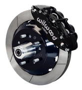 Wilwood black Superlite 6R front caliper beside the assembled 12.88-inch slotted rotor and hub for listed Chevrolet full-size and Corvette spindle