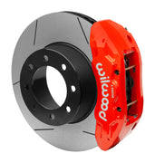 Wilwood red TX6R rear caliper beside the assembled 16.00-inch slotted rotor and hat for Ram 2500 and 3500