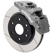 Wilwood anodized AERODM front caliper beside the assembled 13.38-inch slotted rotor and hat for GM armored-vehicle