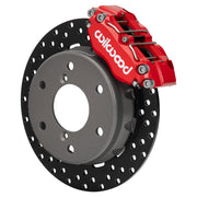 Wilwood red NDPR front caliper beside the assembled 11.60-inch drilled rotor and hat for Can-Am Maverick R