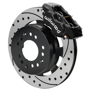 Wilwood black Dynalite front caliper beside the assembled 12.19-inch drilled and slotted rotor and hat for aluminum ProSpindle