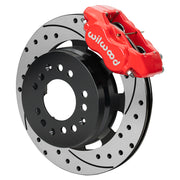 Wilwood red Dynalite front caliper beside the assembled 12.19-inch drilled and slotted rotor and hat for aluminum ProSpindle