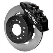 Wilwood black DP6A front caliper beside the assembled 12.19-inch plain rotor and hat for aluminum ProSpindle