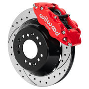 Wilwood red FNSL6R front caliper beside the assembled 12.88-inch drilled and slotted rotor and hat for aluminum ProSpindle