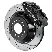 Wilwood black FNSL6R front caliper beside the assembled 14.00-inch drilled and slotted rotor and hat for aluminum ProSpindle