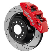 Wilwood red AERO6 front caliper beside the assembled 14.00-inch drilled and slotted rotor and hat for aluminum ProSpindle