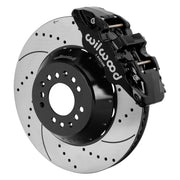 Wilwood black AERO6 front caliper beside the assembled 15.00-inch drilled and slotted rotor and hat for aluminum ProSpindle