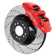 Wilwood red AERO6 front caliper beside the assembled 15.00-inch drilled and slotted rotor and hat for aluminum ProSpindle