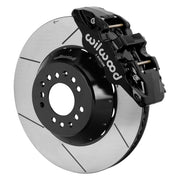 Wilwood black AERO6 front caliper beside the assembled 15.00-inch slotted rotor and hat for aluminum ProSpindle
