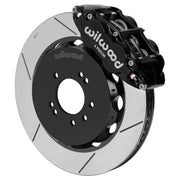 Wilwood black FNSL6R front caliper with 14.00-inch slotted rotor, assembled brake view for 1999–2002 Nissan Skyline R34