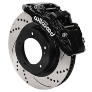 Wilwood black AERO6-DM front caliper with 13.39-inch drilled and slotted rotor, assembled brake view for 2007–2015 Toyota Tundra / 2008–2015 Sequoia