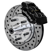 Wilwood black Forged Dynalite Internal front caliper with 11.00-inch drilled and slotted rotor, assembled brake view for 1955–1957 Chevrolet with Aftermarket Drop Spindles