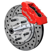 Wilwood red Forged Dynalite Internal front caliper with 11.00-inch drilled and slotted rotor, assembled brake view for 1955–1957 Chevrolet with Aftermarket Drop Spindles