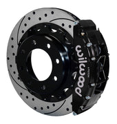 Assembled view of a Wilwood black TC6R rear caliper with a 16.00-inch drilled and slotted rotor