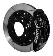 Assembled view of a Wilwood black TC6R rear caliper with a 16.00-inch slotted rotor