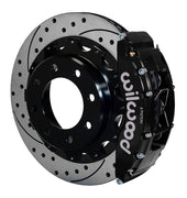 Assembled view of a Wilwood black TC6R rear caliper with a 16.00-inch drilled and slotted rotor