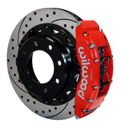 Assembled view of a Wilwood red TC6R rear caliper with a 16.00-inch drilled and slotted rotor