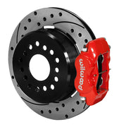 Assembled view of a Wilwood red FDLI rear caliper with a 12.19-inch drilled and slotted rotor