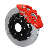 Assembled view of a Wilwood red AERO6 front caliper with a 14.25-inch slotted rotor