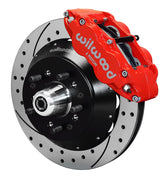 Assembled view of a Wilwood red FNSL6R front caliper with a 12.88-inch drilled and slotted rotor