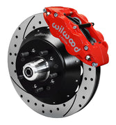 Assembled view of a Wilwood red FNSL6R front caliper with a 12.88-inch drilled and slotted rotor