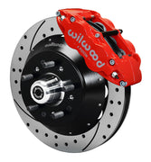 Assembled view of a Wilwood red FNSL6R front caliper with a 14.00-inch drilled and slotted rotor